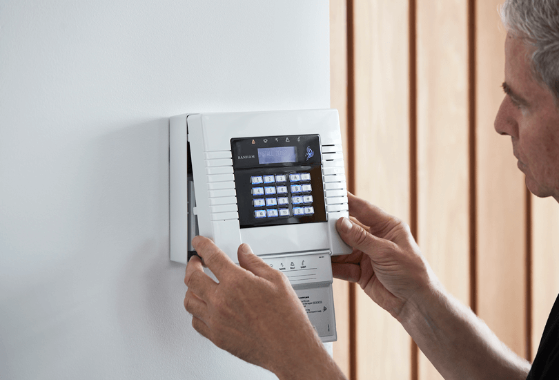 Banham Engineer Installing White Alarms Panel