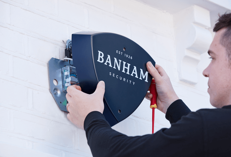 Banham Enginner Installing Navy Banham Alarm Bellbox