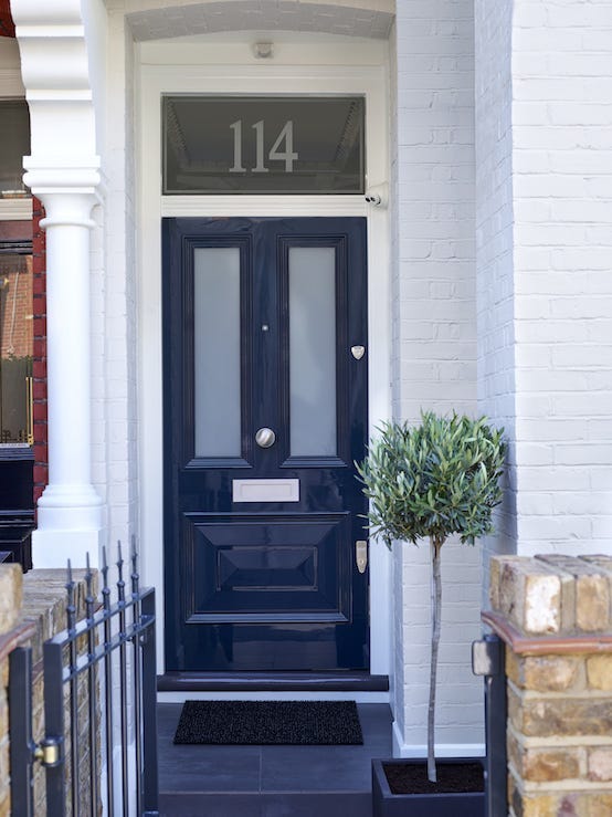 Front of House with Navy Blue Banham Door, Chrome Door Locks, Letter Plate, Door Knob, Eye View and Black Railings