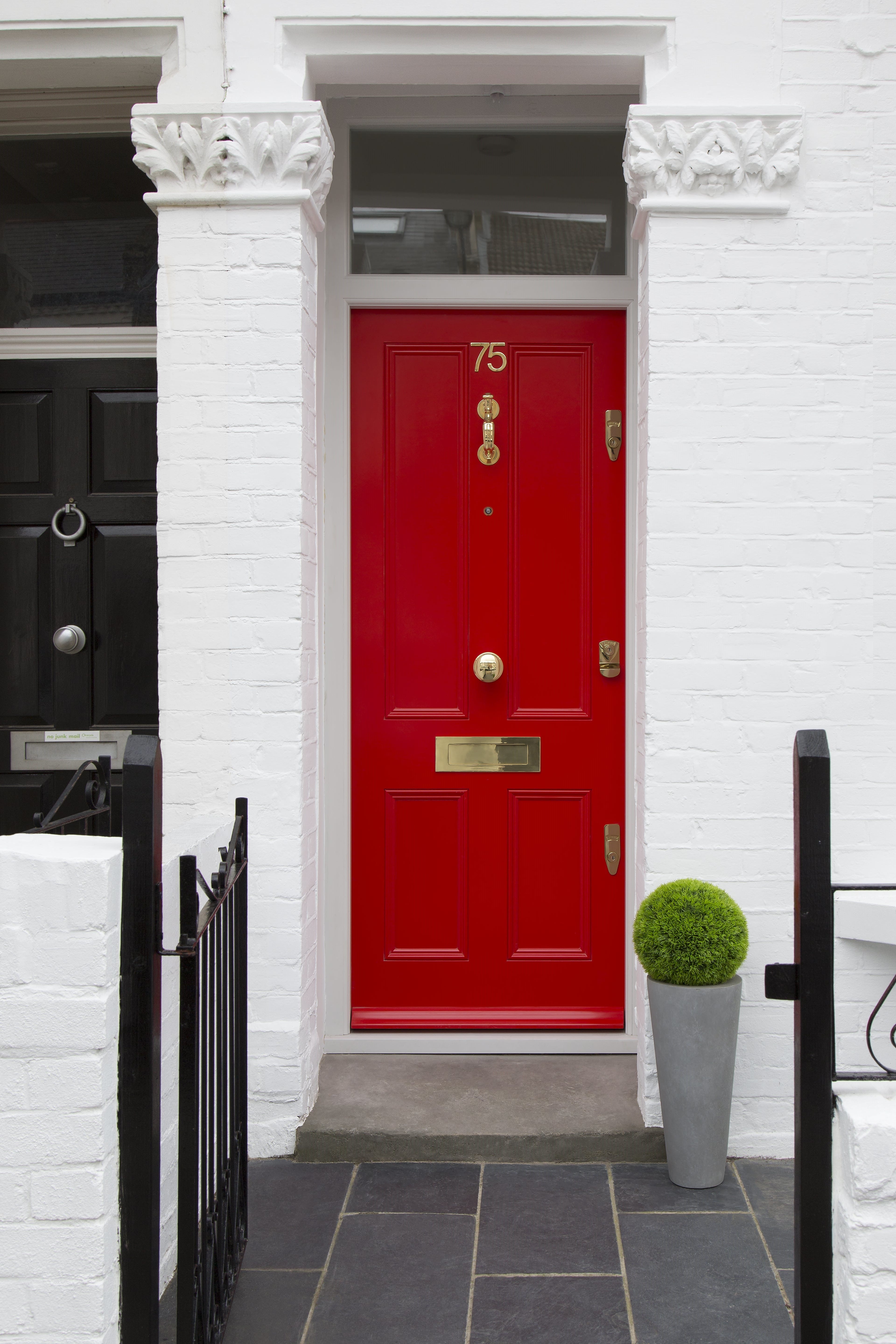 Front of House with Red Banham Door with Brass Door Locks, Letter Plate, Door Knob, Doctor's Door Knocker, Eye View and Black Railings, as well as Black Banham Door with Chrome Door Knocker, Door Knob and Letter Plate